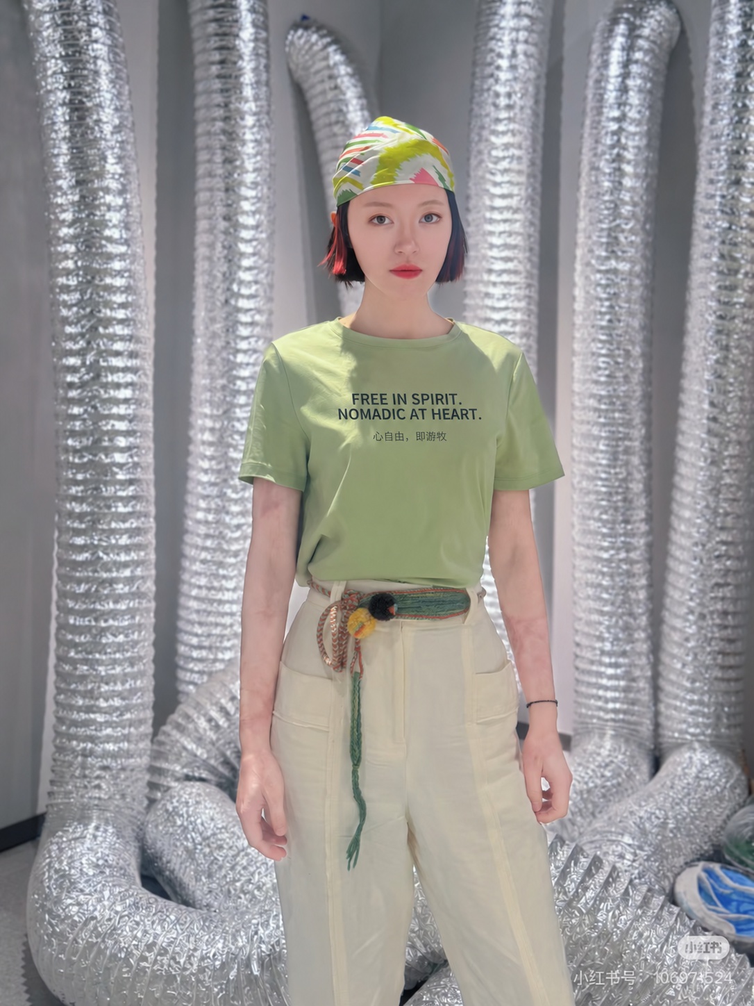 Wurdoo woven chain styled as a belt with a green brand slogan T-shirt