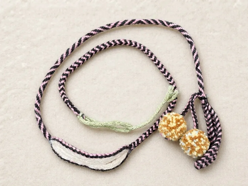 Dopamine D03 — Black-white cord · Cream pom-poms