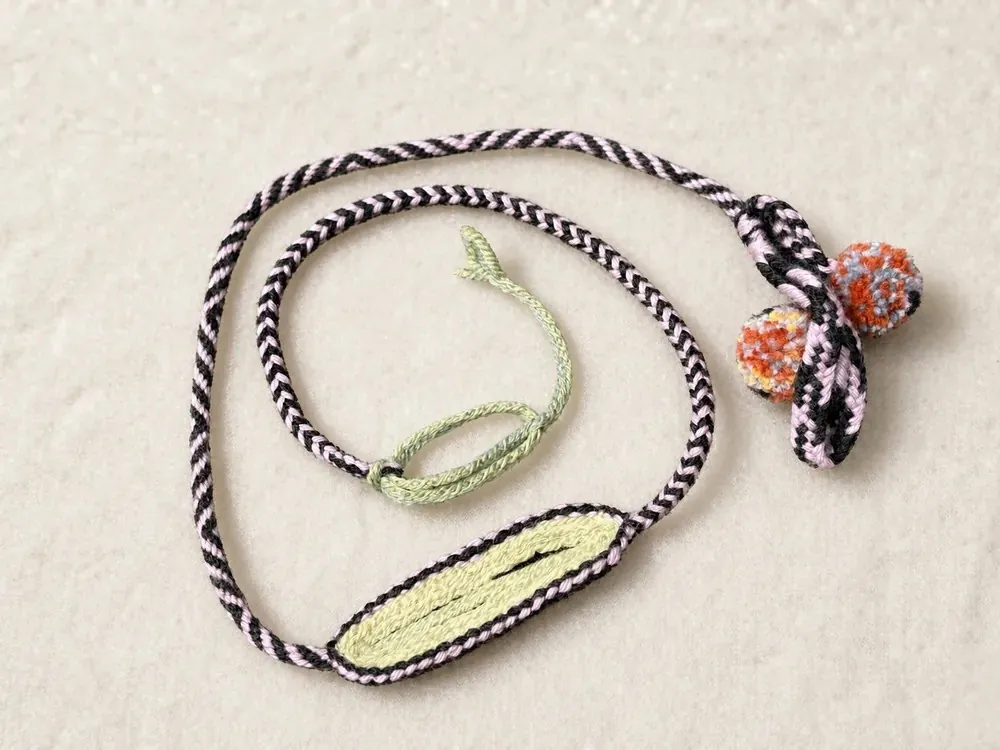 Dopamine D16 — Black-white cord · Coral beads · Yellow panel