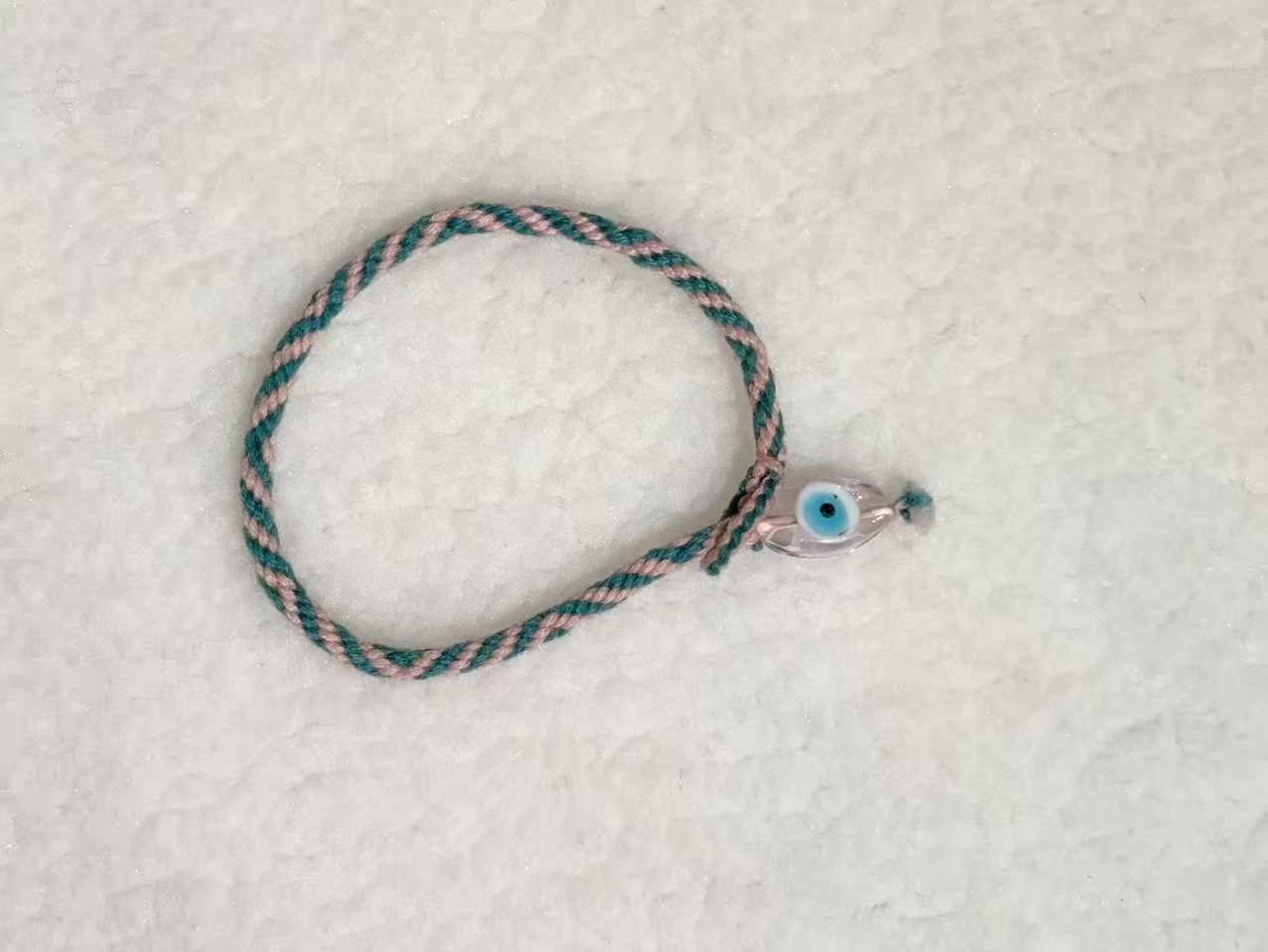 Evil Eye E02 — Teal & cream · Pale charm