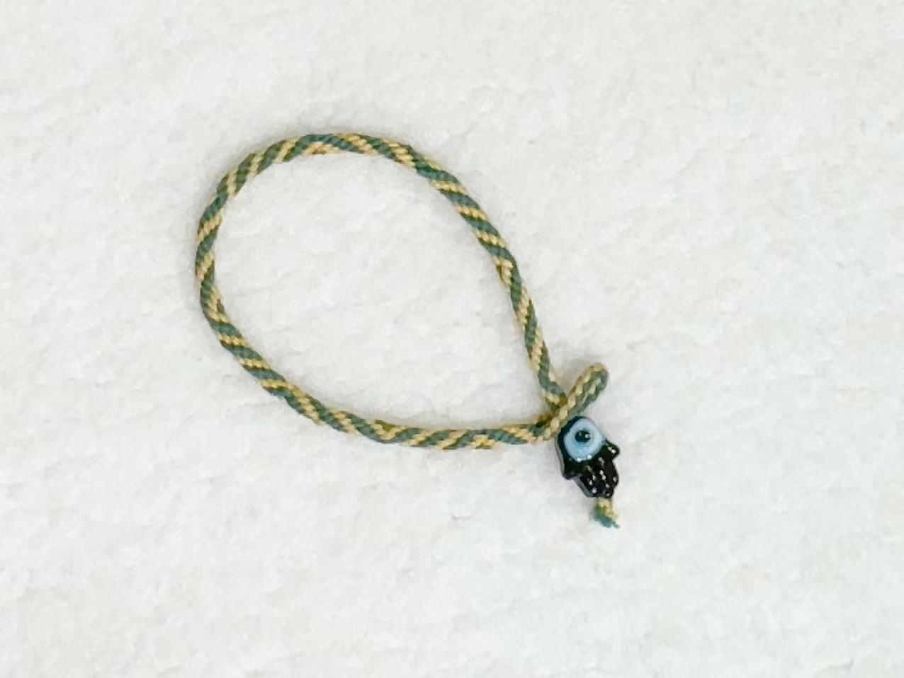 Evil Eye E11 — Olive & cream · Dark charm